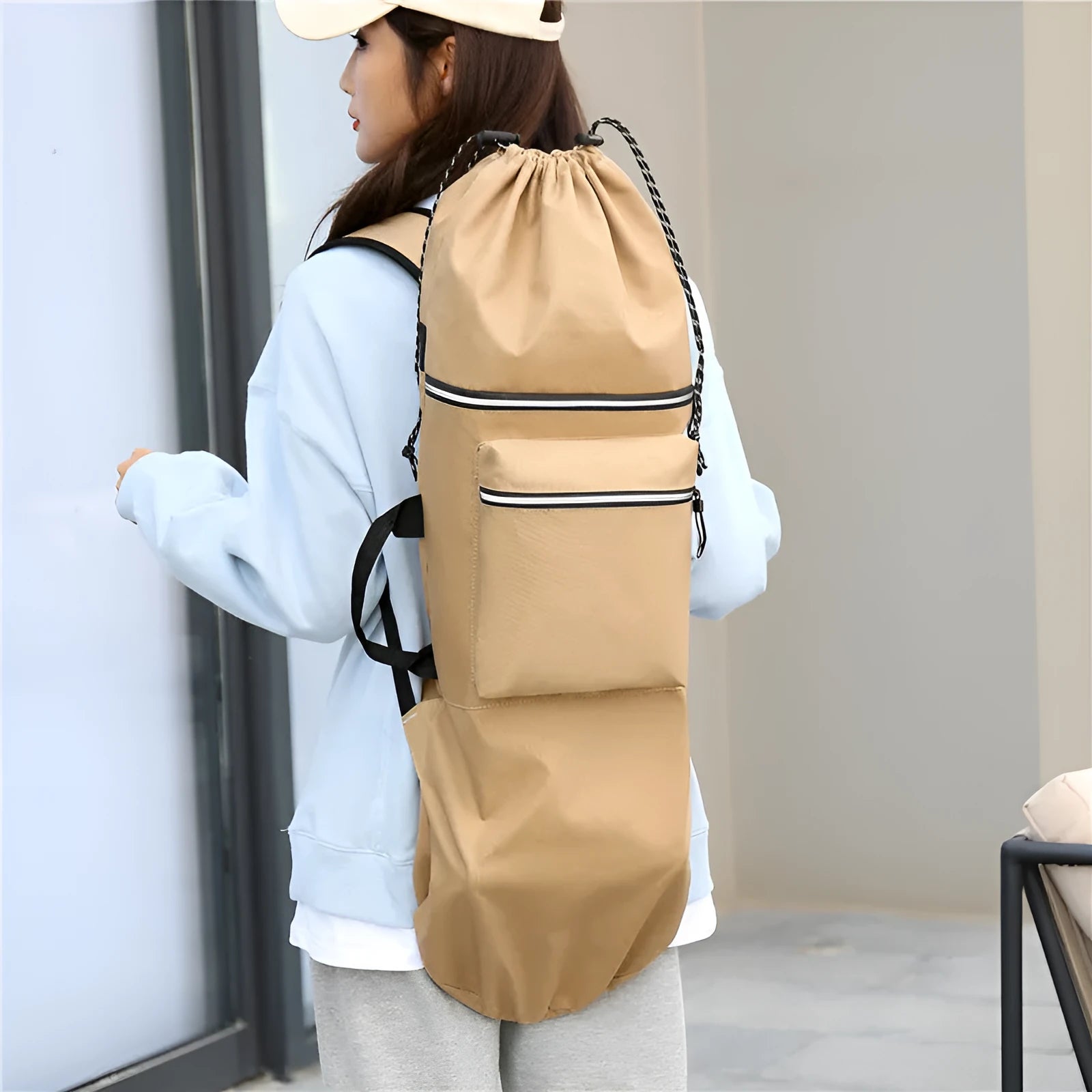 Waterproof nylon skate bag for yoga and outdoor sports gear in black, showing 20-35 litre capacity.