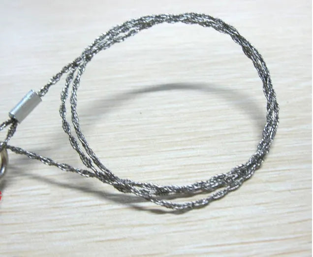 Stainless steel survival wire saw with thumb rings measuring 55cm cutting length