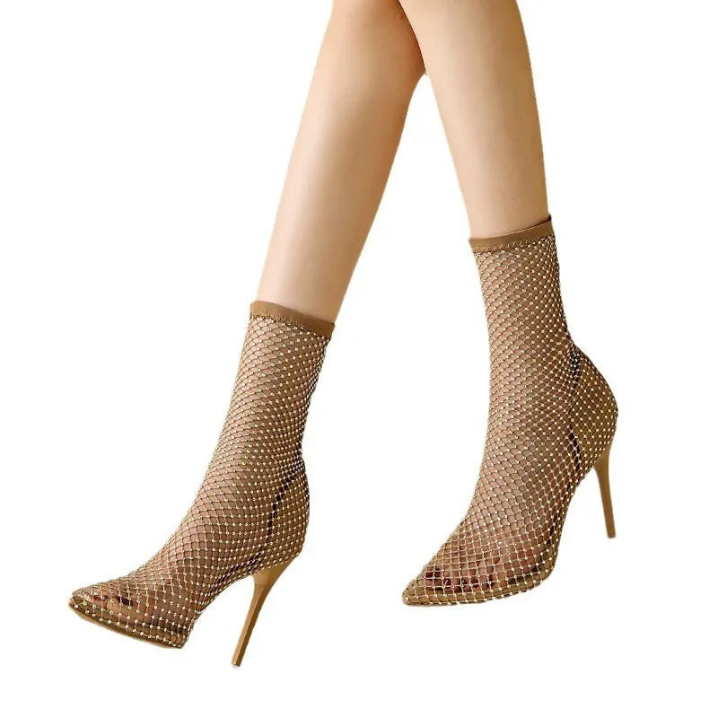 Gold women's high heel sandals with mesh upper, pointed toe, stiletto heel, and rubber sole.
