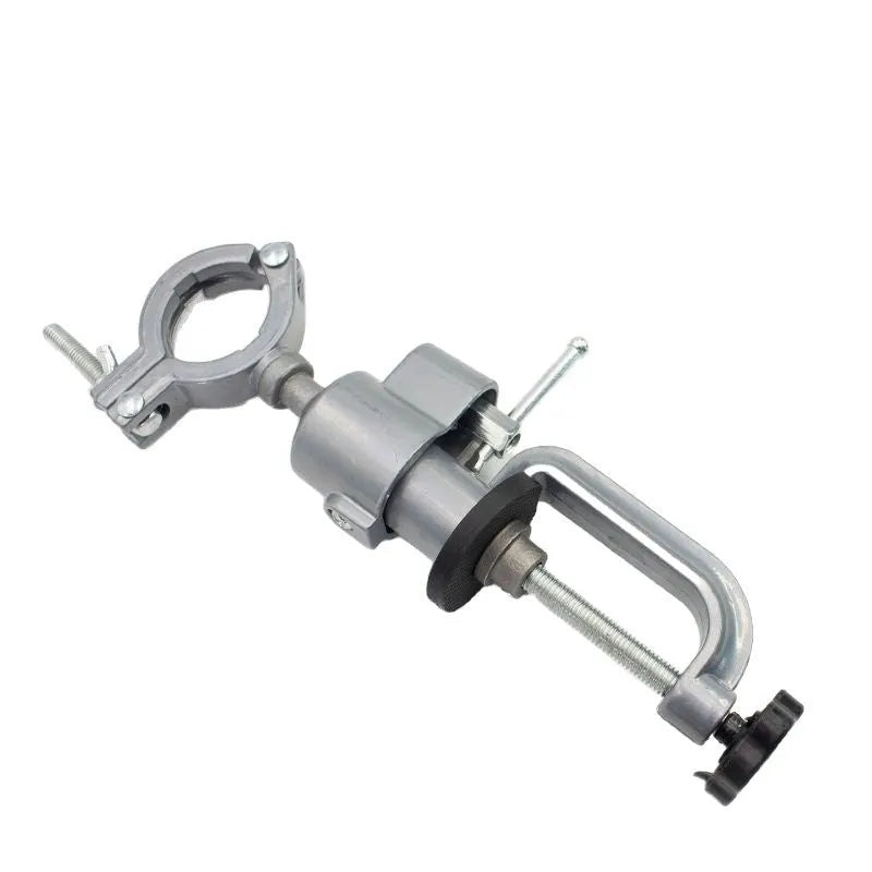 Small bracket-type bench vise with a 360-degree rotating head on a workbench.