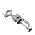 Small bracket-type bench vise with a 360-degree rotating head on a workbench.