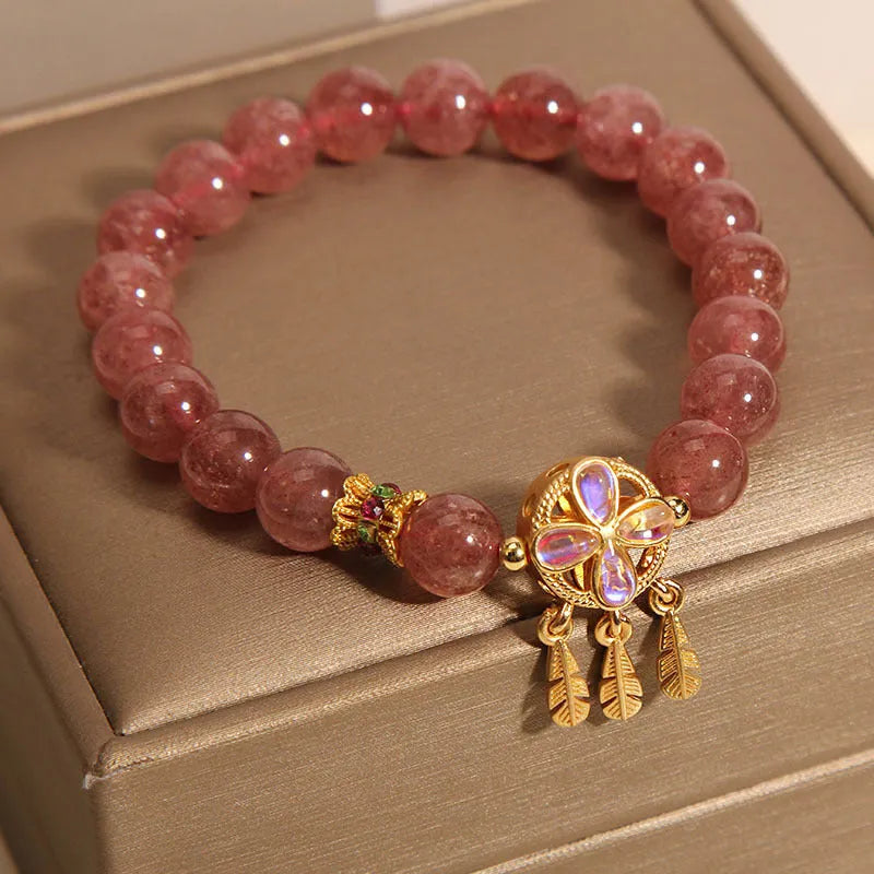 Women's strawberry quartz crystal bracelet with four-leaf dream catcher ball pendant