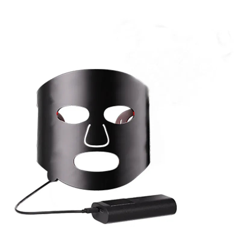 Black and white LED phototherapy face mask with controller for home skincare light therapy treatment