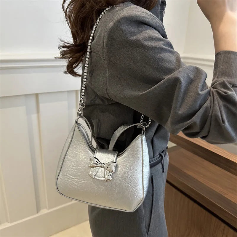 PU dumpling underarm bag with one-shoulder strap, sandwich pocket, sewing thread detail, shown in black