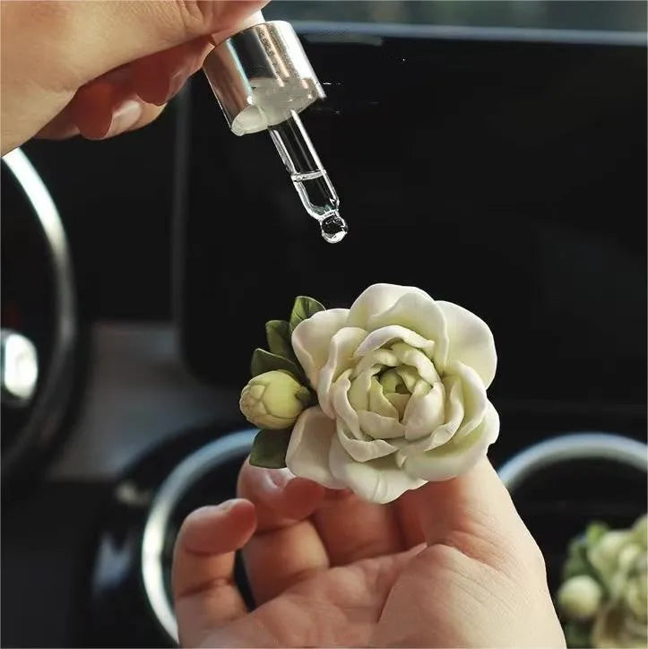 Jasmine car perfume solid air outlet freshener in off white or fresh green colour on car vent