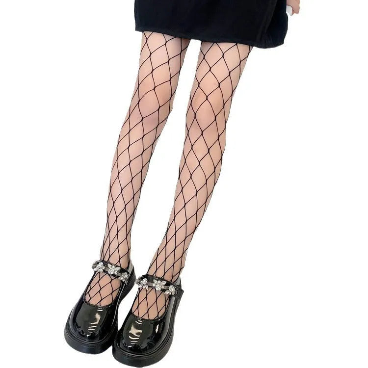 Women's mesh stockings showing large, medium and small patterns in black and white colours