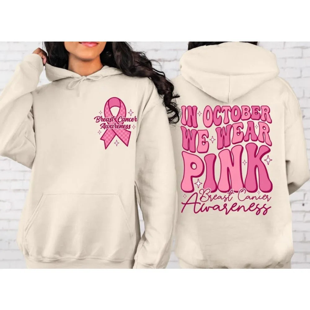 Breast cancer awareness pullover hoodie in pink with retro art design and a side seam pocket.