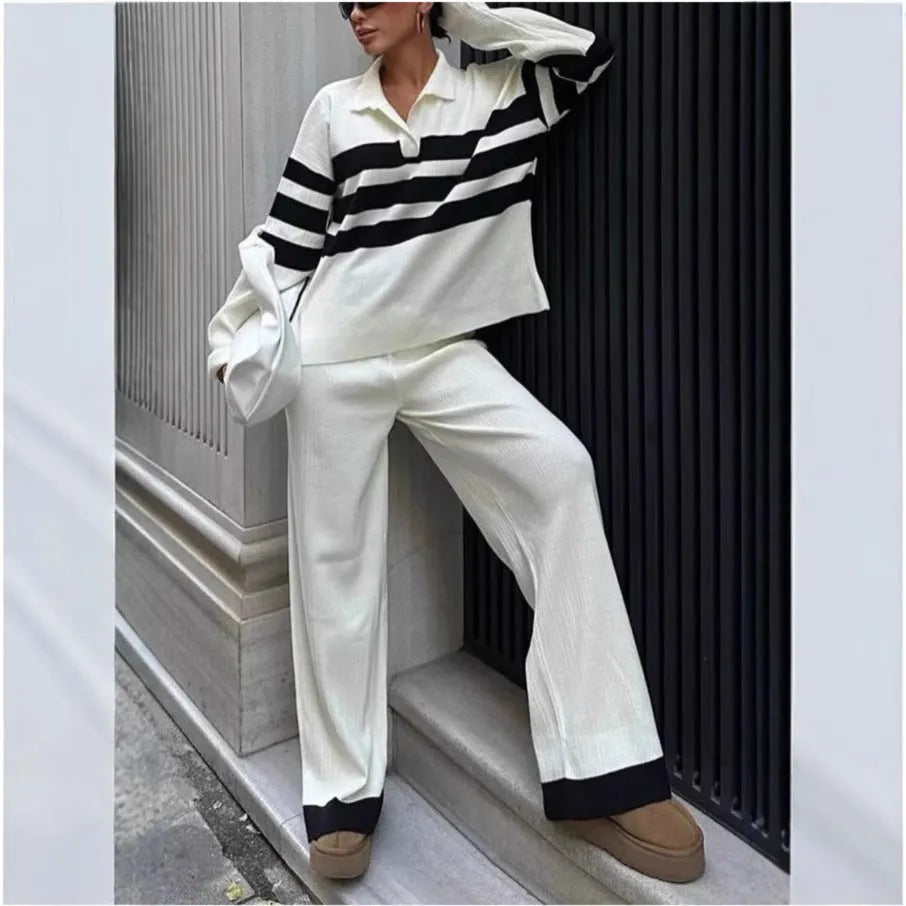 Women's black and white striped knitted two-piece set with polo collar top and matching trousers