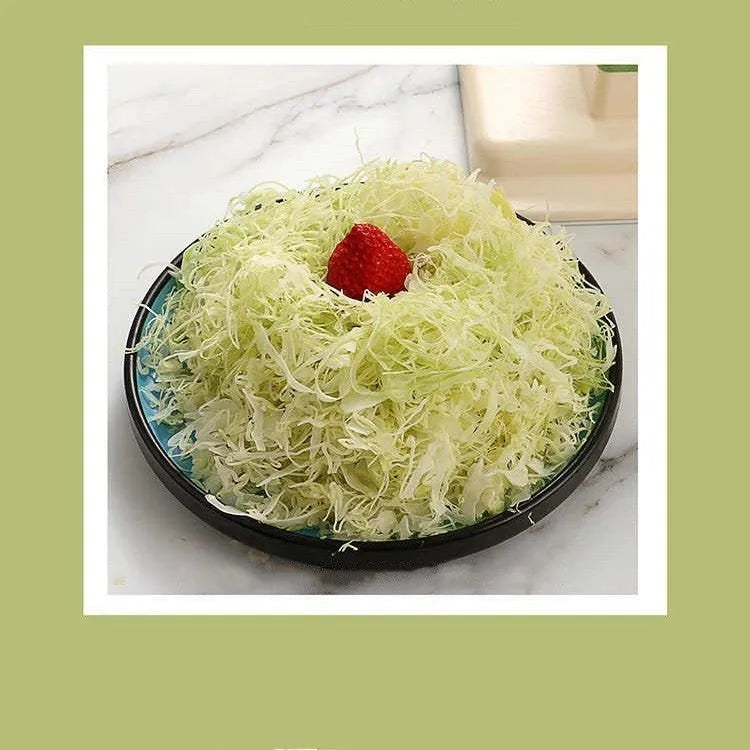 Beige stainless steel vegetable slicer chopper grater with spiralizer function on kitchen counter