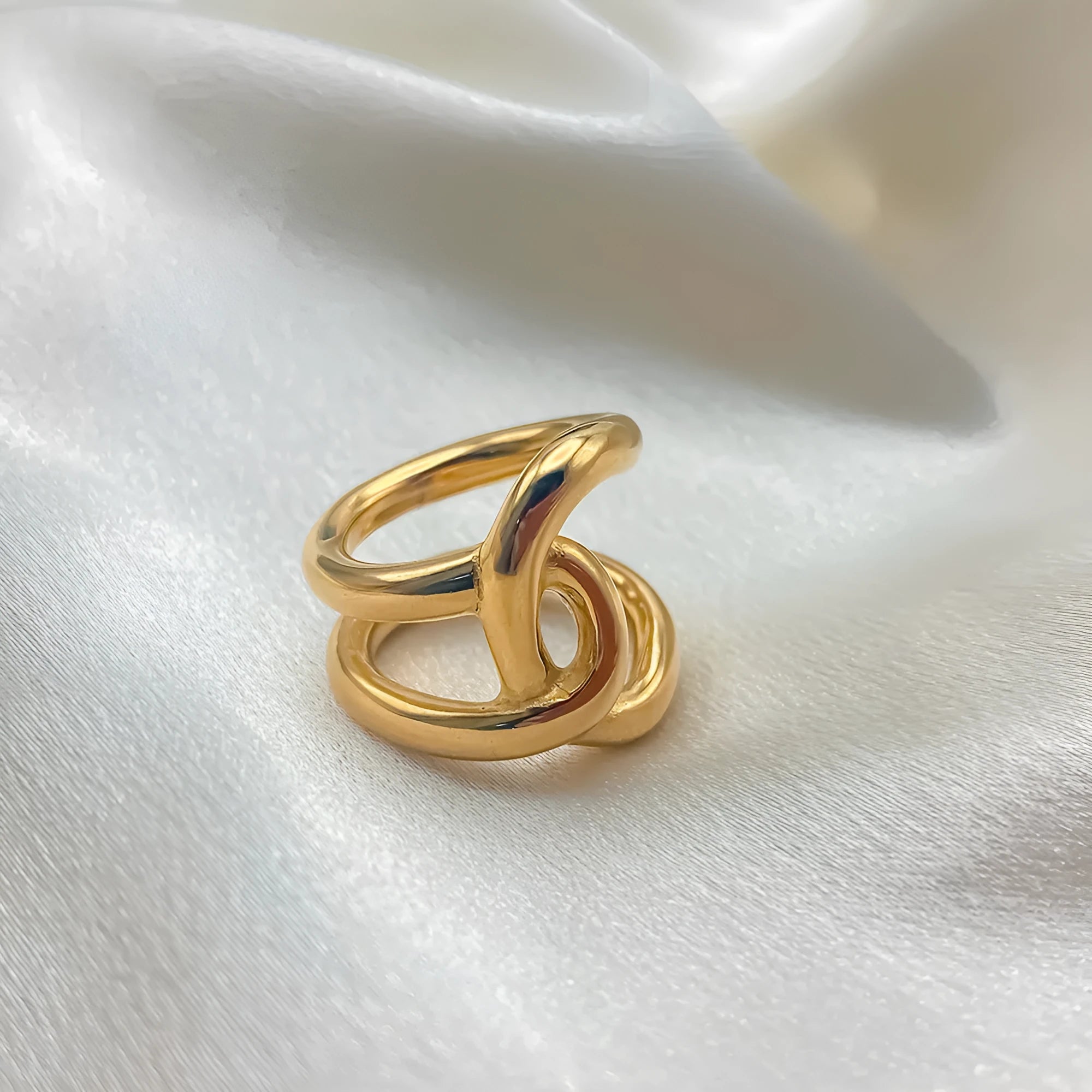 Adjustable knotted ring for women showing geometric U-shape design with line detailing