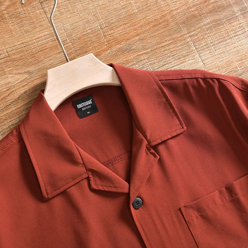Man wearing a loose-fitting, solid colour short sleeve shirt in a Japanese fresh cardigan style.