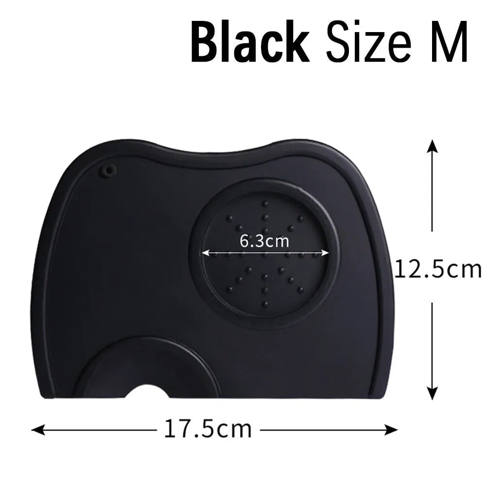 Black non-slip silicone coffee tamper pad with stainless steel base and integrated filling corner.