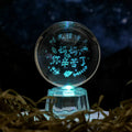 Transparent white crystal ball ornament with inner carving design measuring 6cm in diameter