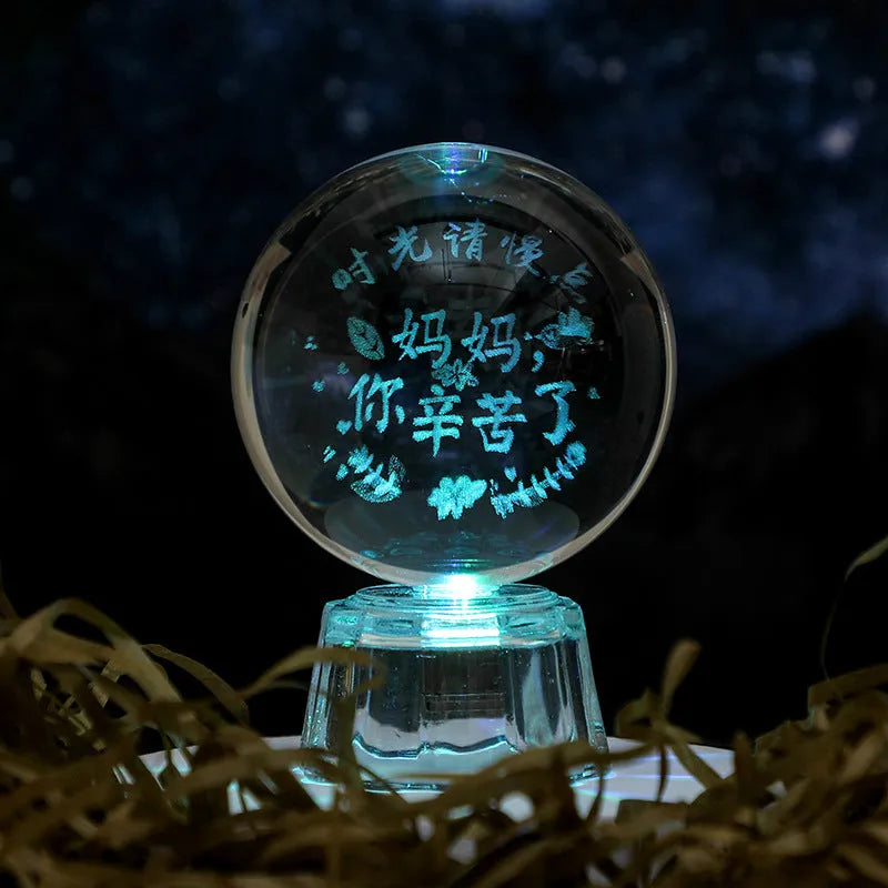 Transparent white crystal ball ornament with inner carving design measuring 6cm in diameter