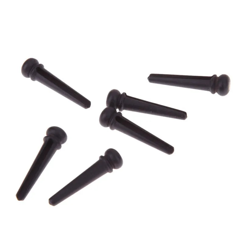 Six ebony folk guitar string nails with matt black finish for acoustic guitar repair