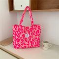 Oxford cloth women's shoulder bag with three-dimensional pockets in colour options including black, pink, and sapphire blue