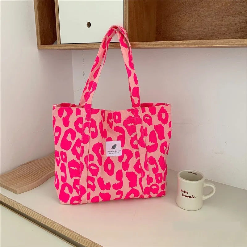 Oxford cloth women's shoulder bag with three-dimensional pockets in colour options including black, pink, and sapphire blue