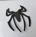 Three-dimensional metal spider car sticker in gold, silver, black, or red.