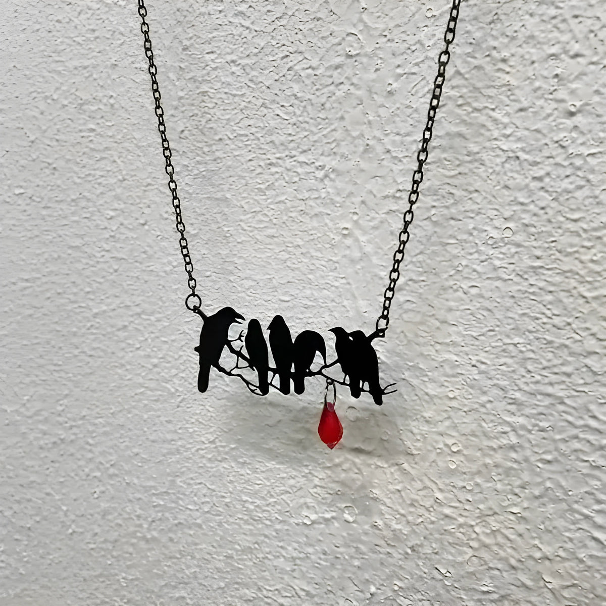 Black crow necklace with Gothic styling and cross chain design