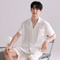 Man's lightweight ice silk pajama set in a blue houndstooth satin jacquard pattern, cardigan style with short pants.