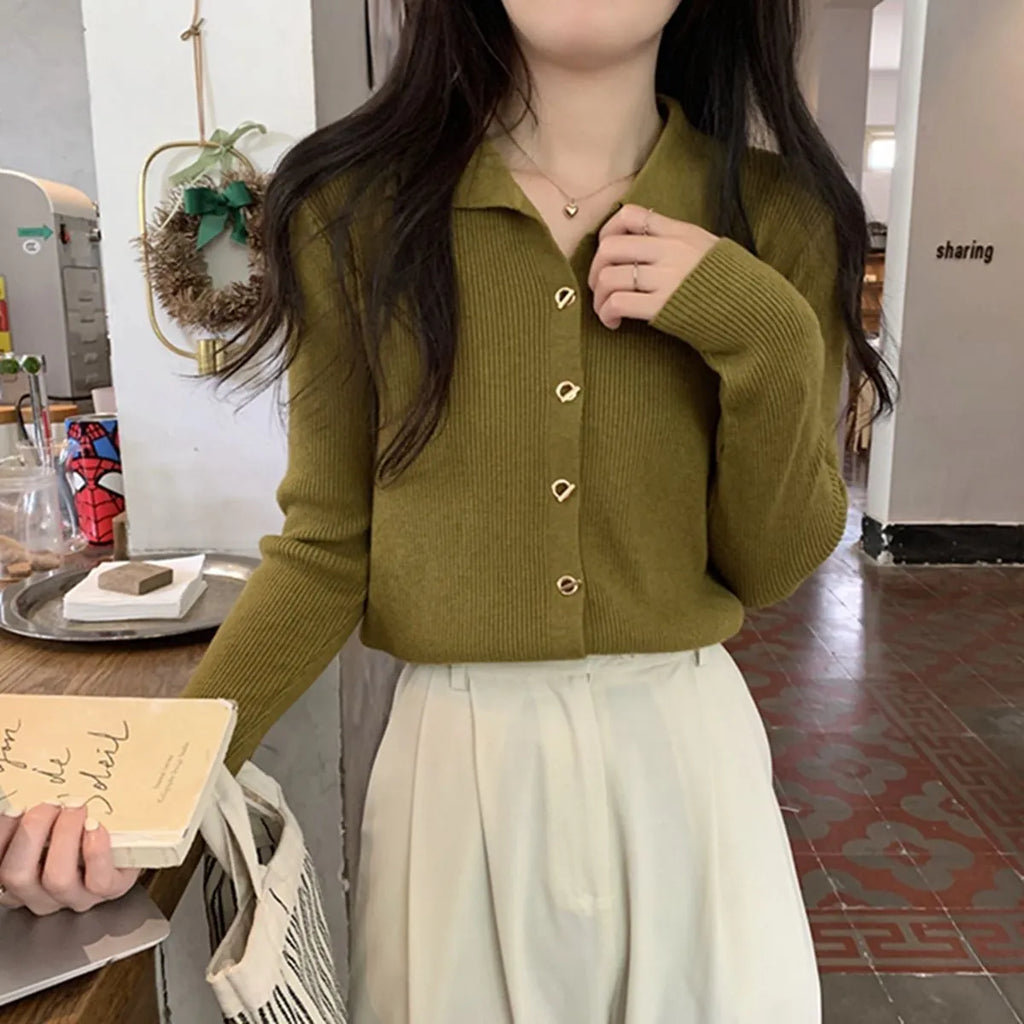 Long-sleeve viscose knit cardigan in loose fit, shown in beige colour on hanger.