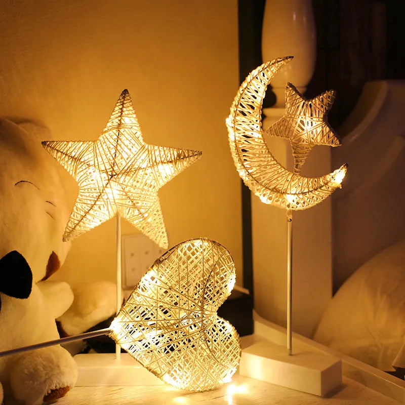 Rattan and PC LED decorative lamp in star, heart, or moon shape on a table.