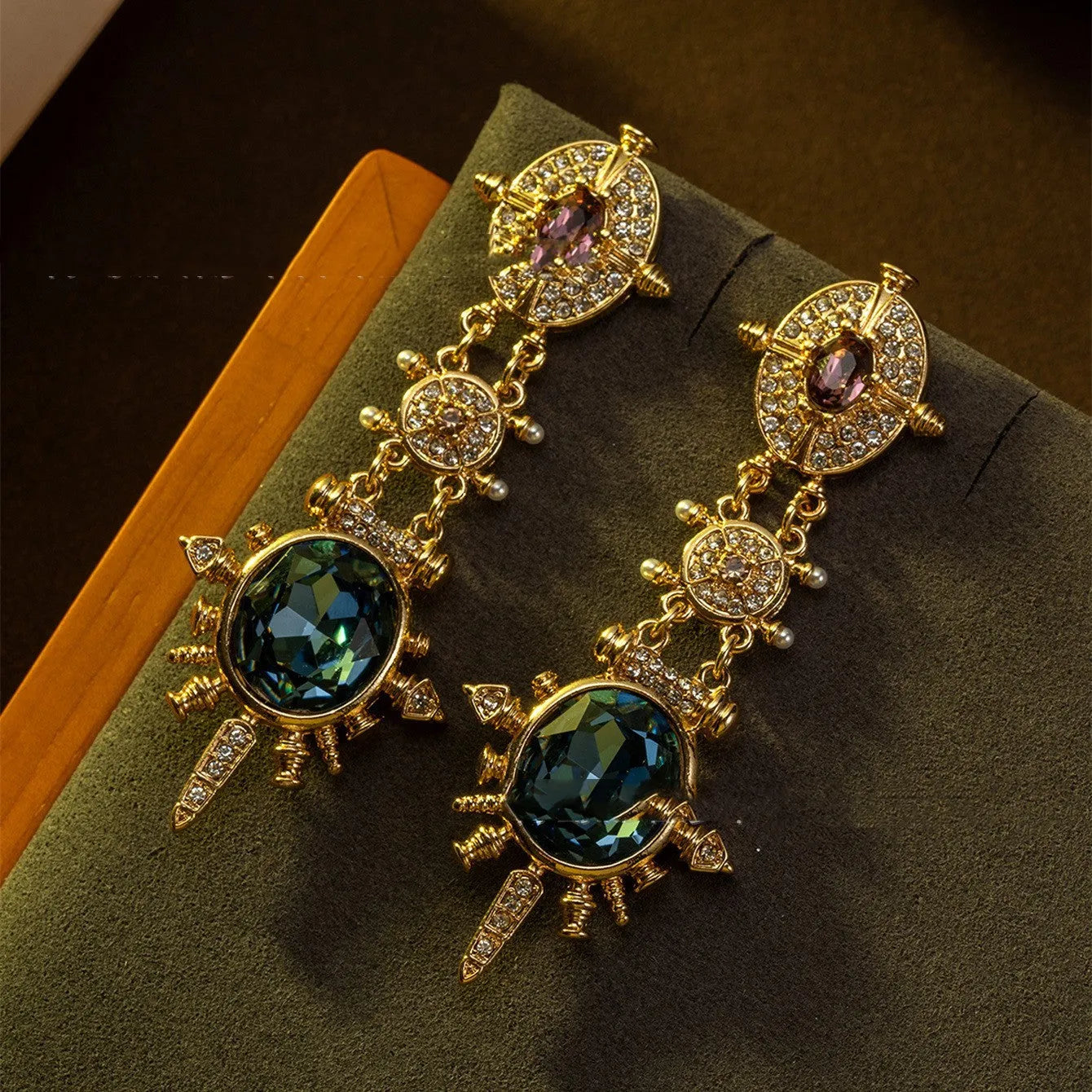 Pair of geometric gold retro stud earrings with diamond treatment surface