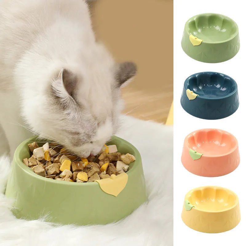 Green flower-shaped plastic pet bowl for cat or small dog food and water.