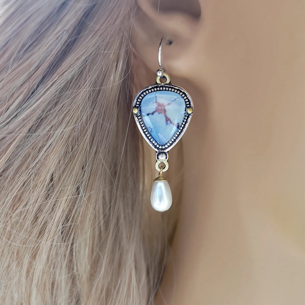 Retro blue drop earrings with synthetic blue opal and white pearl on electroplated metal.