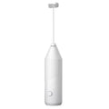 Mini handheld electric milk frother in black, white, and khaki colours with a stainless steel whisk.