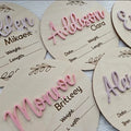 Square wooden name plate for newborn showing birth details and surname, 15cm.