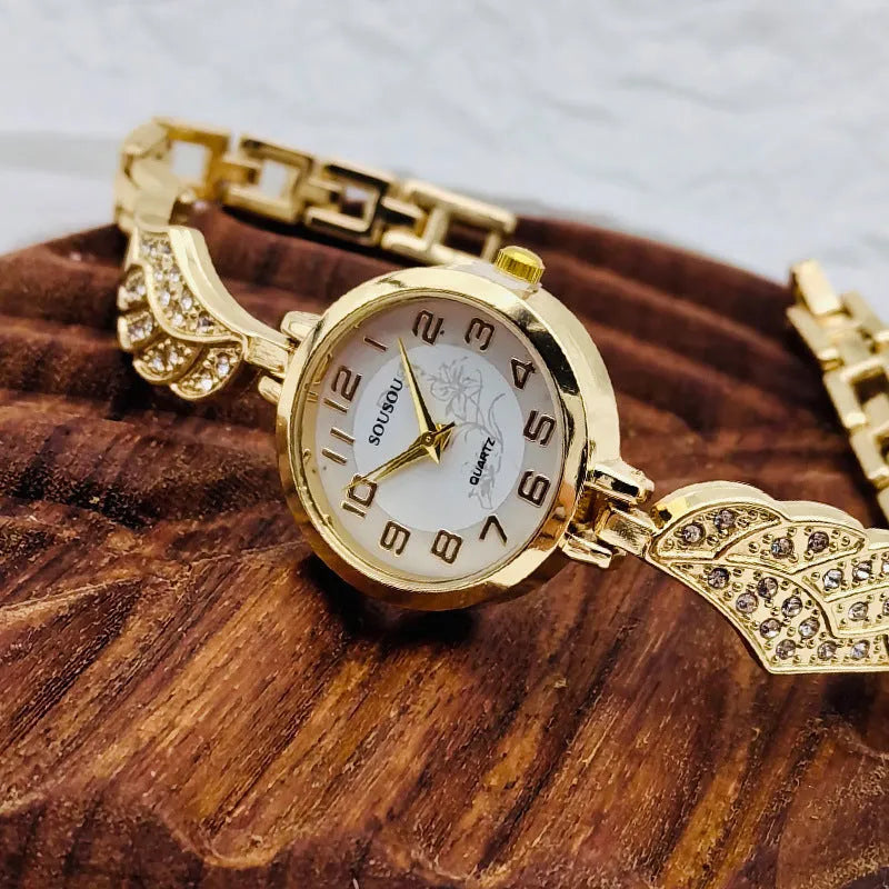 Stainless steel women's watch with round dial showing gold surface option and vachette clasp