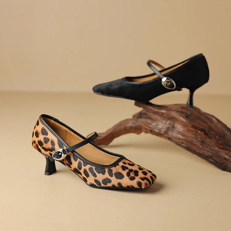 Women's black square toe stiletto heel ankle-strap shoes with a horse hair upper.