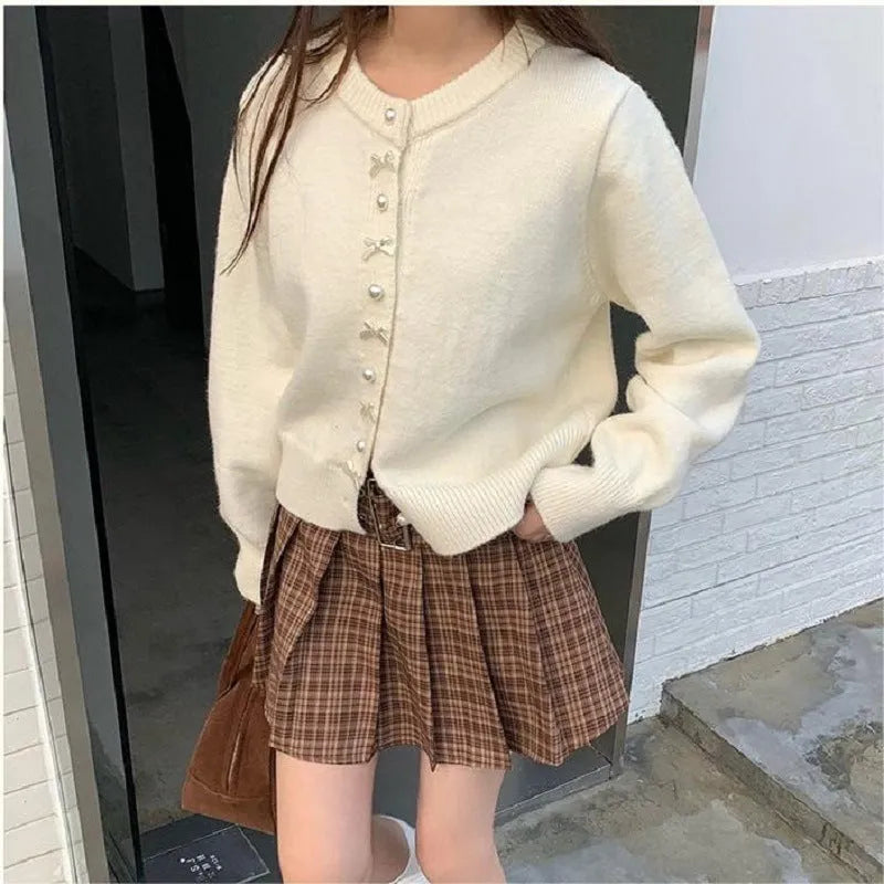 Women's bow detail pearl button cashmere blend cardigan sweater in regular fit