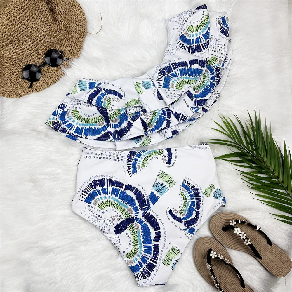 White women's one-shoulder swimsuit with lotus leaf pattern and split skirt design