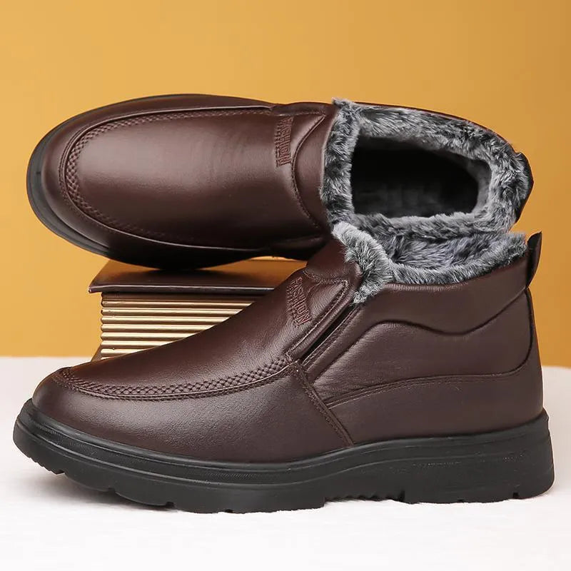 Men's black winter slip-on shoes with fleece lining and a textured non-slip rubber sole.