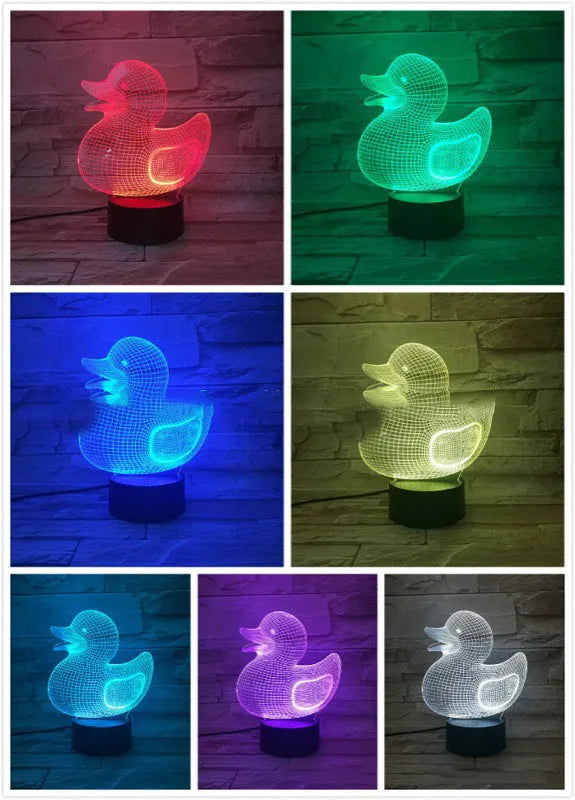 3D little yellow duck night light with colourful LED illumination on a table