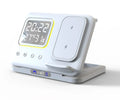 Black or white 5-in-1 wireless charging station with LED display showing time and temperature, charging phone and watch.