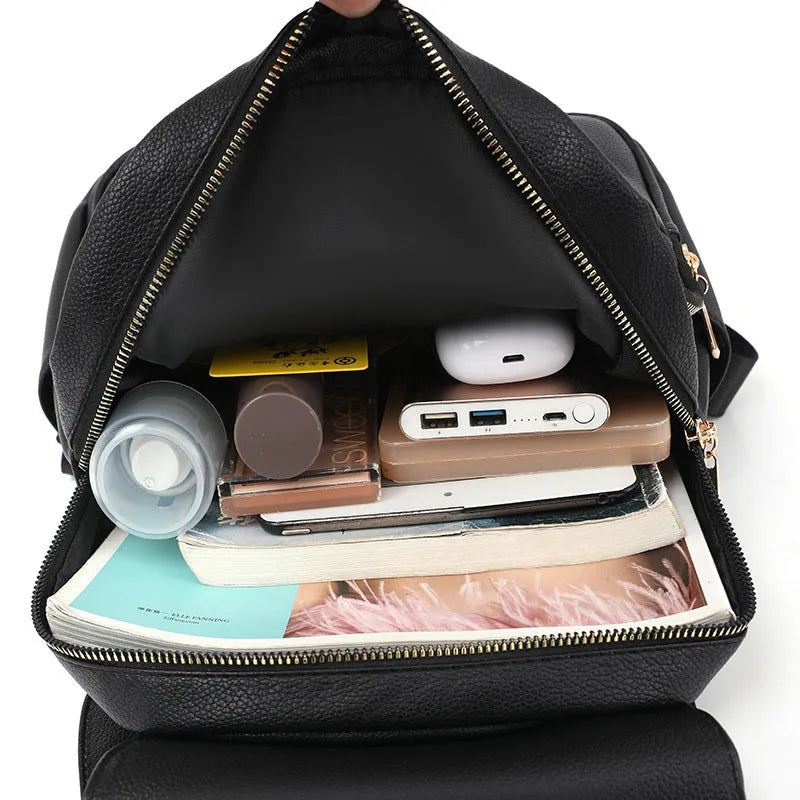 Women's casual leather backpack in street style with three-dimensional pockets and adjustable straps