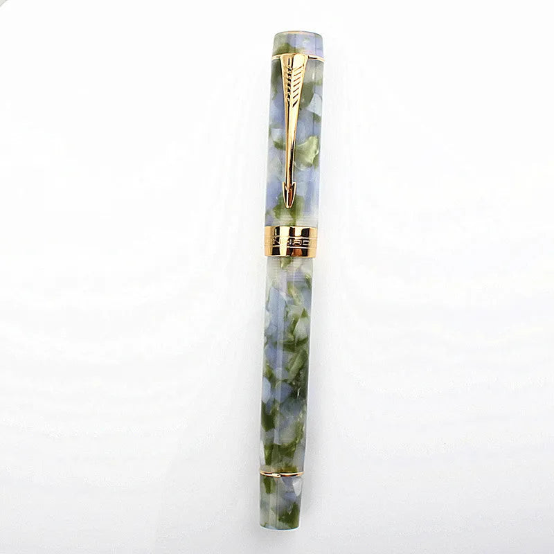 Deep bath green metal ballpoint pen with three removable tips: fine, medium, and graphic.