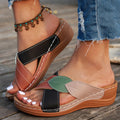 Women's black thick-soled slippers with cross-strap design and peep-toe opening