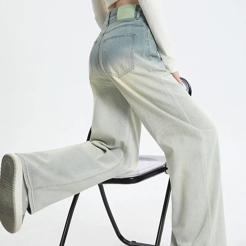 Women's gradient blue straight-leg denim trousers with wide leg design on hanger