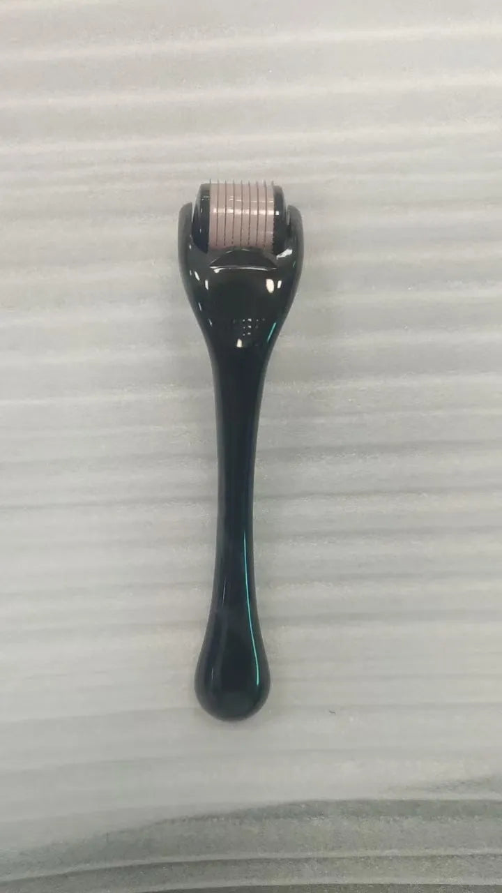 Sterile 540 micro needle derma roller showing handle and needle wheel in assorted colours.