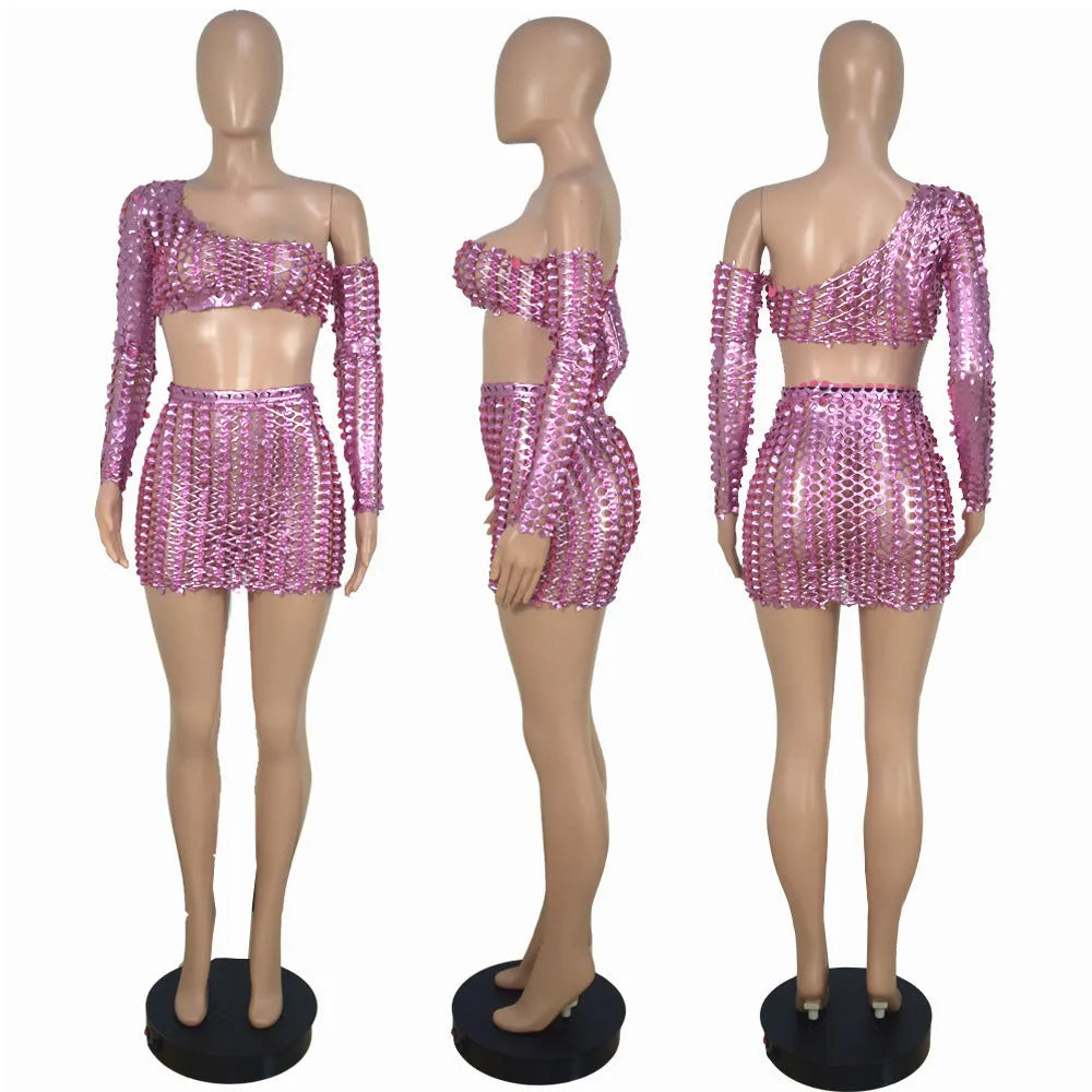 Women's black hollow-out net two-piece dress set with sleeveless top and short skirt.