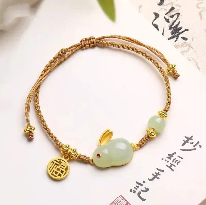 Hetian jade rabbit bracelet with geometric charm on yellow adjustable string