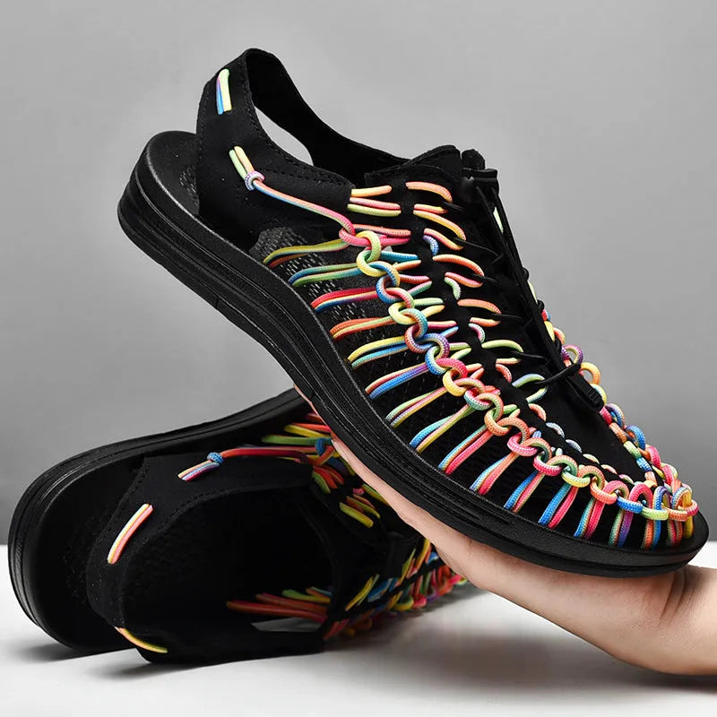 Woven sandals with elastic drawstring tie closure in rainbow colour on a rubber sole.