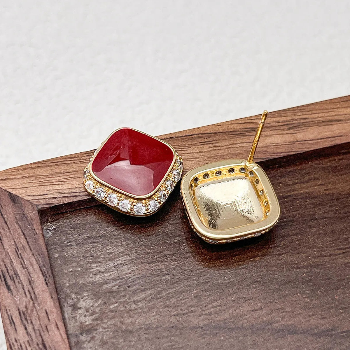 Red geometric alloy drop earrings with square detail for women.