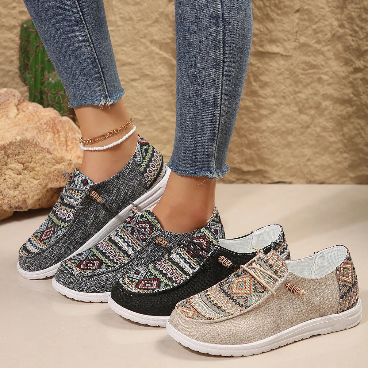 Women's black flat round toe low-top shoes with an oversleeve design on a white background.
