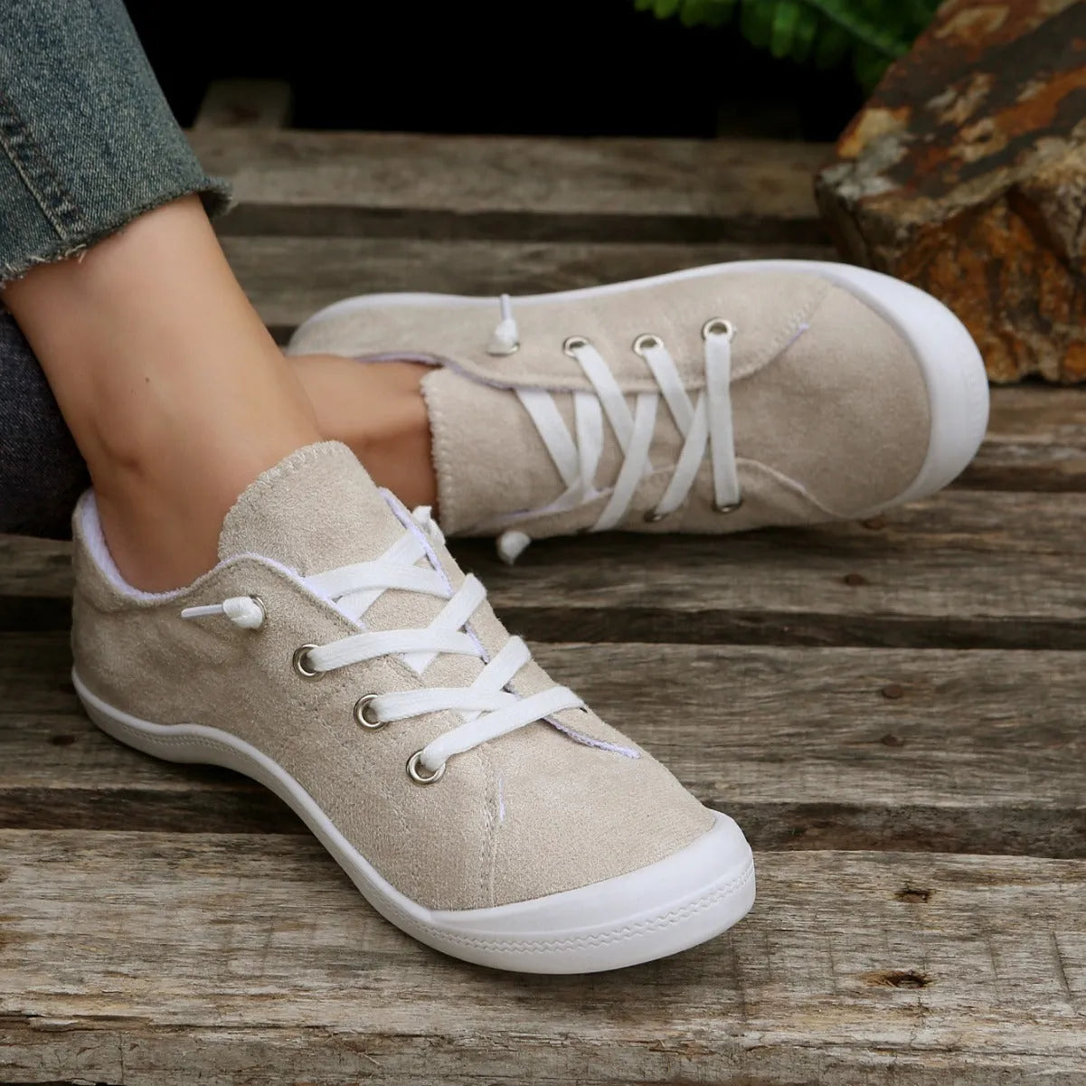 Women's creamy-white fabric casual sneakers with low-top design and rubber soles