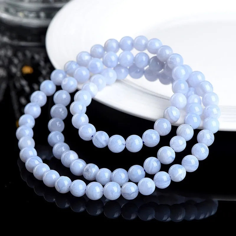 Blue agate multi-circle bracelet with 6-6.8mm beads showing Ruyi pattern and unisex design